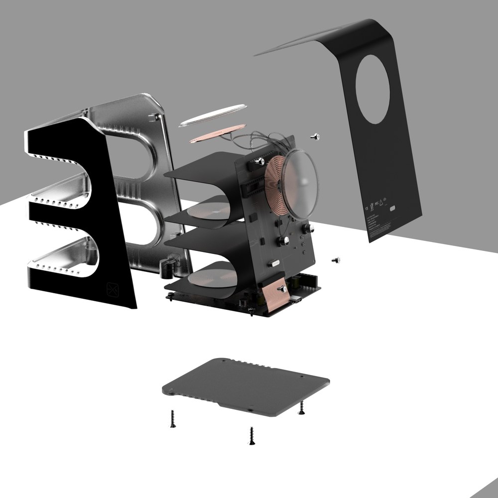 Focus Dock exploded view showing five-part construction, coils, PCB and fasteners